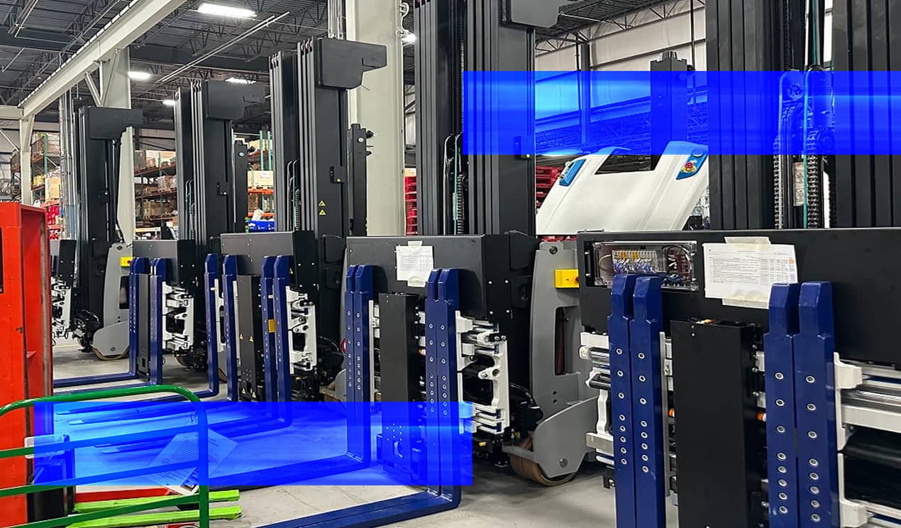 A row of automated guided vehicles (agvs) positioned inside a warehouse facility.