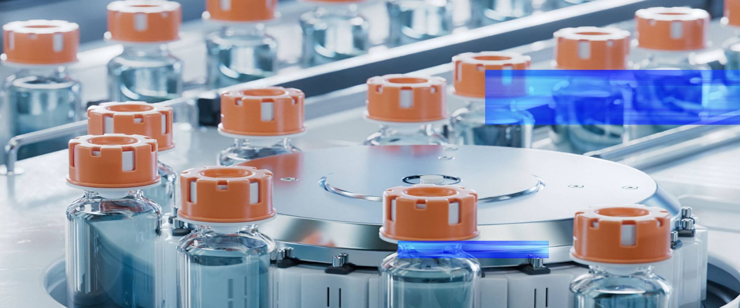 Automated pharmaceutical production line processing sealed medical vials.