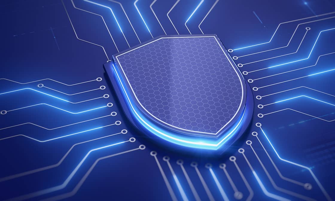A digital shield icon sits at the center of a glowing circuit board graphic, representing cybersecurity and secure mobile automation software for connected automation solutions.