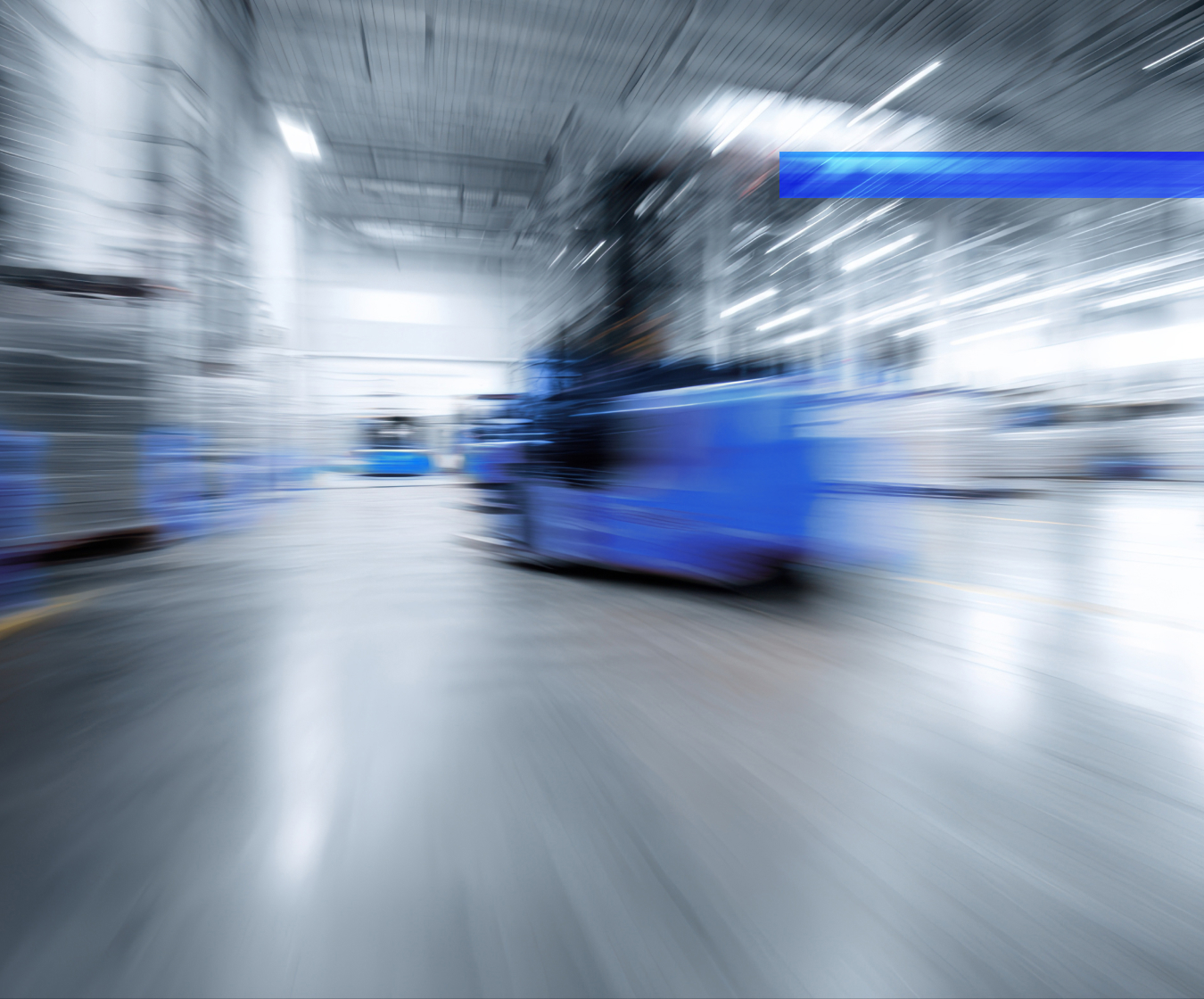 Automated guided vehicles move through a warehouse fulfillment area.