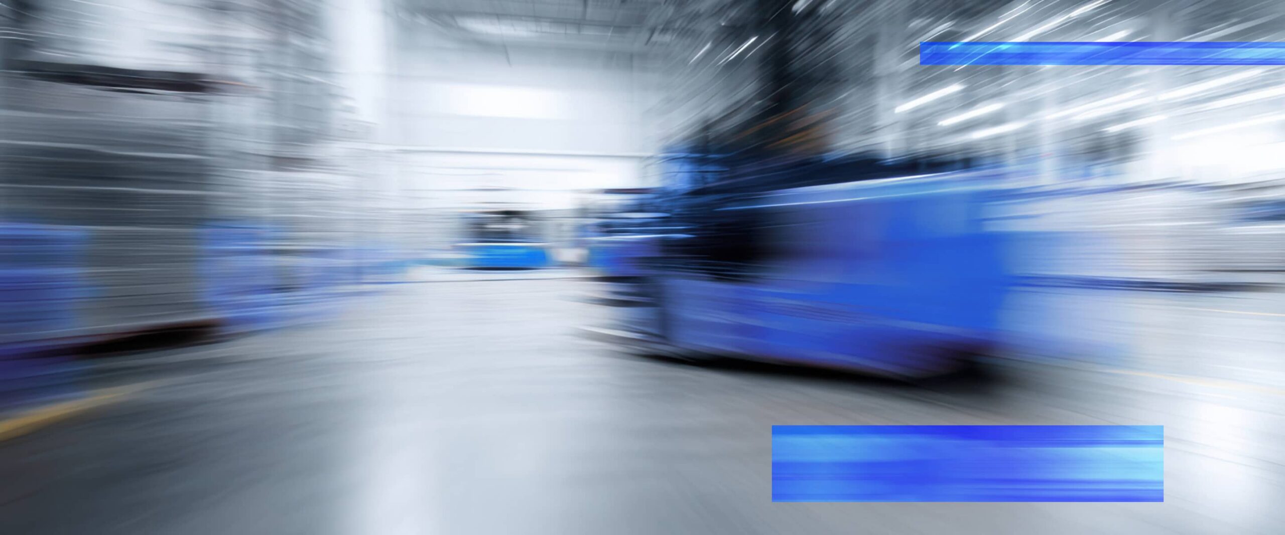 Automated guided vehicles move through a warehouse fulfillment area.